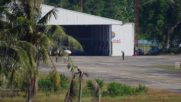 Small transport aircaft taxiing from hangar video