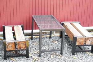 Table for sitting in the garden . Used for dining, reading. photo