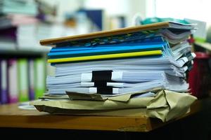 stack of papers on the desk photo