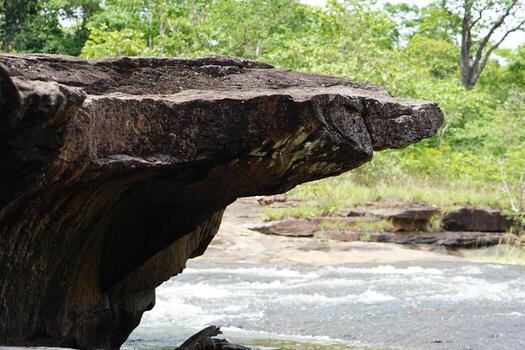 large rock that was eroded by water and wind to form a beautiful pattern. photo