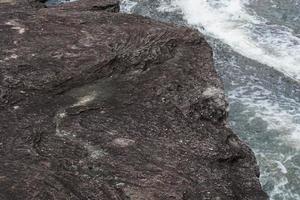 wind stone background. erosion creates a beautiful pattern beside the river. photo