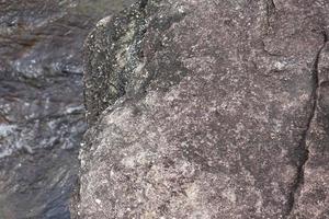 wind stone background. erosion creates a beautiful pattern beside the river. photo