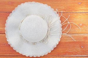 Summer sun hat on the wood floor photo