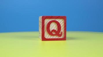 Close up shot letter Q alphabet wooden block video