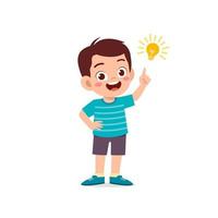 cute little kid boy show idea pose expression with light bulb sign vector