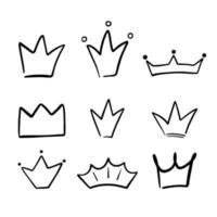 Set of different crowns and tiaras. Hand drawn doodle crown isolated on white. Vector sketch