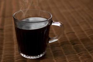 Americano coffee on rattan table top photo