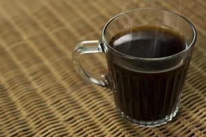 Americano coffee on rattan table top photo