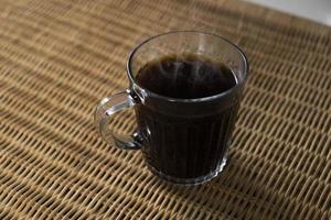 Americano coffee on rattan table top photo