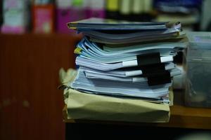 stack of papers on the desk photo