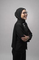 Beautiful muslim woman wearing glasses over white background studio photo