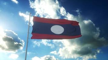 Flag of Laos waving at wind against beautiful blue sky. 3d rendering photo