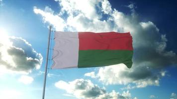 bandera de madagascar ondeando al viento contra el hermoso cielo azul. representación 3d foto