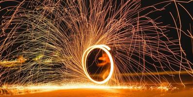 Swing fire dancing show on the beach .Koh Samet, Thailand photo