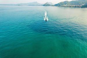 Sea views and rocky islands with a long-tail boat. photo