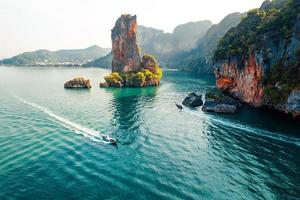 Sea views and rocky islands with a long-tail boat. photo