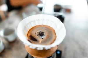 Drip coffee,Pouring hot water in the kettle into the coffee,brew coffee photo