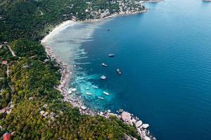 Bay and boats form above in island photo