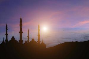 islamic background mountain peak mosque with sunset photo