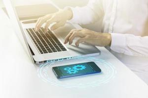 Device connection functionality for efficient system fixes.,Fix and manage system problems on the device.,Businessman working on management system photo