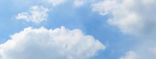 Blue sky and white clouds with sunlight,Blue sky and floating clouds photo