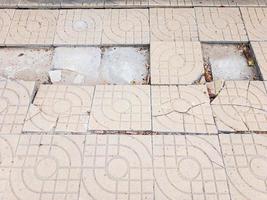 Broken floor tiles with the rain drop. photo