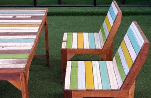 Side view of the painted plank chair and table set in the retro style. photo