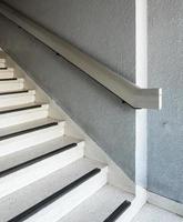 Old concrete staircase with the metal rail. photo