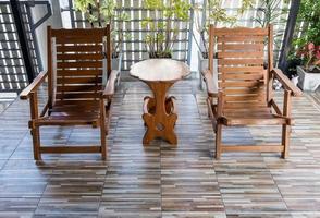 Twin reclining wooden chair on the terrace. photo