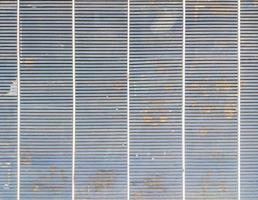 Old metal grate of the empty time table board. photo