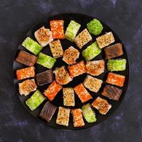 Sushi roll on dark background. Top view photo