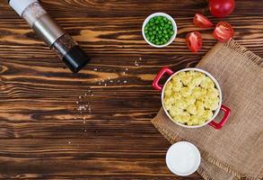 Homemade shepherd's pie on wooden background photo