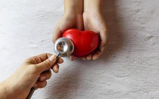 Heart with stethoscope heart examination concept photo