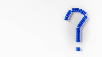 Blue question mark  design from toy puzzle on white background photo