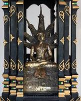 Brass Buddha statue with seven head dargon. photo