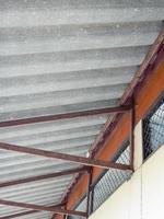 Old metal frame for the fiber cement roof. photo