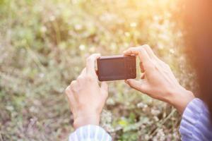 little girl photographs flower outdoor photo