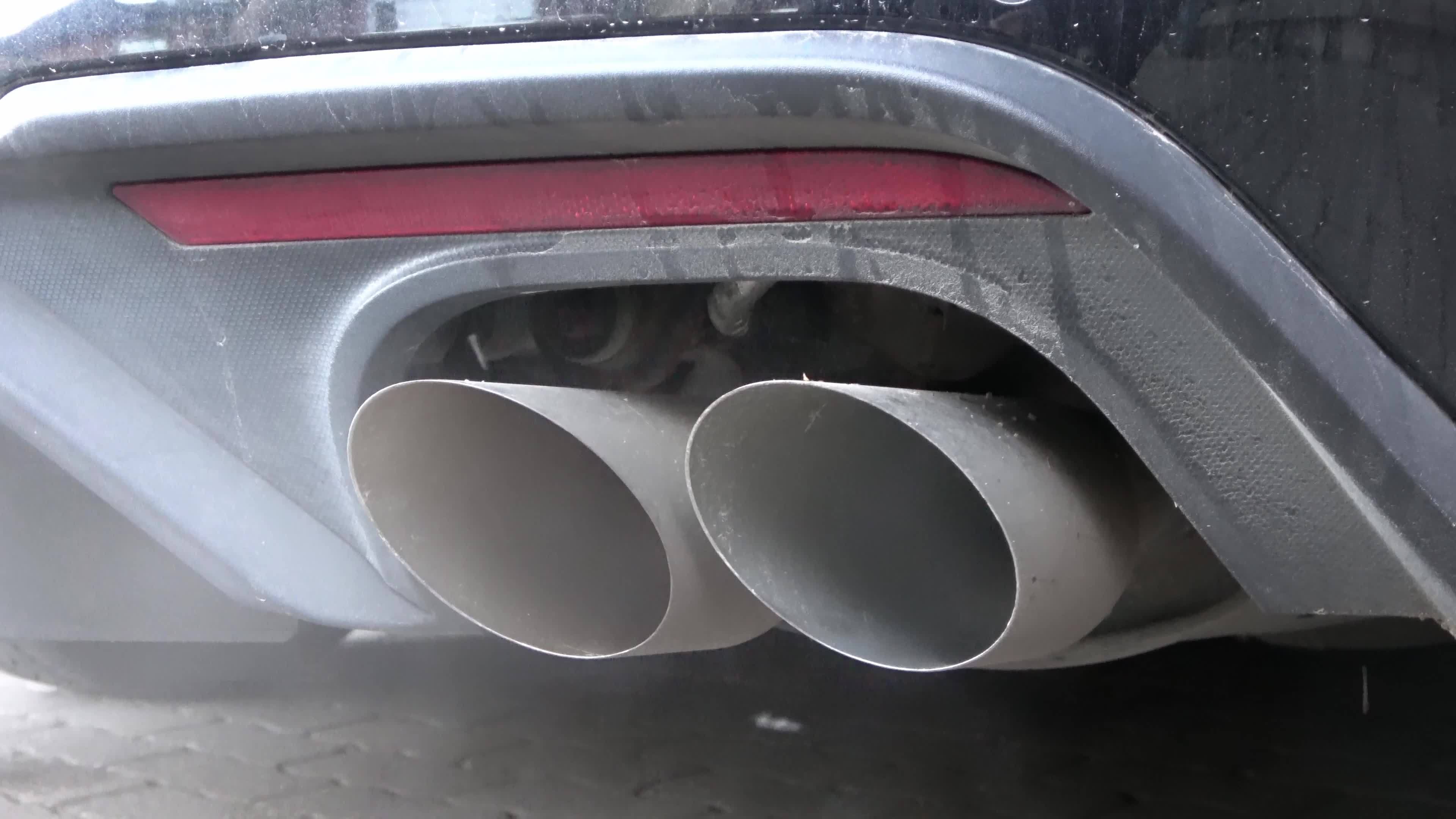 Close up of a flap exhaust when starting the engine of a muscle car