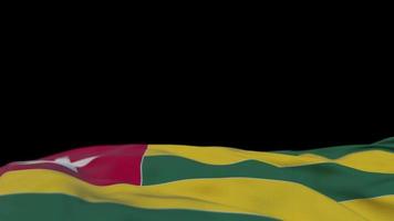 togo tygflagga vajar på vindslingan. togo broderi stickad tyg banner vajande på vinden. halvfylld svart bakgrund. plats för text. 20 sekunders loop. 4k video