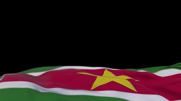Suriname fabric flag waving on the wind loop. Surinamese embroidery stiched cloth banner swaying on the breeze. Half-filled black background. Place for text. 20 seconds loop. 4k video
