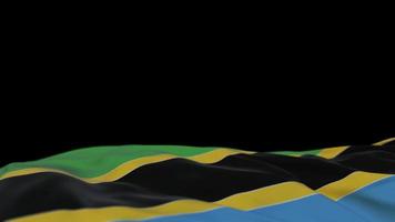 tanzania tygflagga vajar på vindslingan. tanzanian broderi stickad tyg banner vajande på vinden. halvfylld svart bakgrund. plats för text. 20 sekunders loop. 4k video