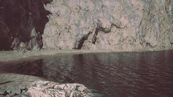 View of a high cliff and black ocean video