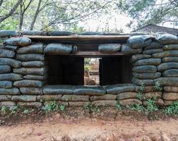 Cement shelter with sandbag. photo