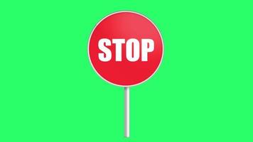Animation red STOP sign on green background. video