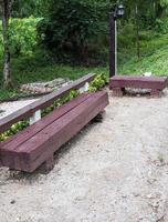 Hard wooden bench from the old sleeper. photo