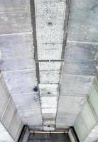 Bottom view of concrete bridge photo
