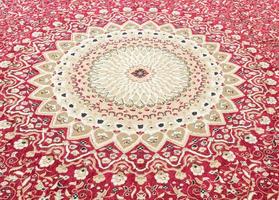 Floral pattern on the wool carpet. photo