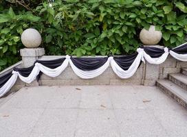 Marble staircase which decorate by the black and white fabric. photo