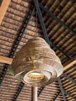 Electrical lamp with the bamboo weave. photo