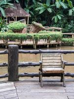 Old wooden chair on the wooden terrace. photo